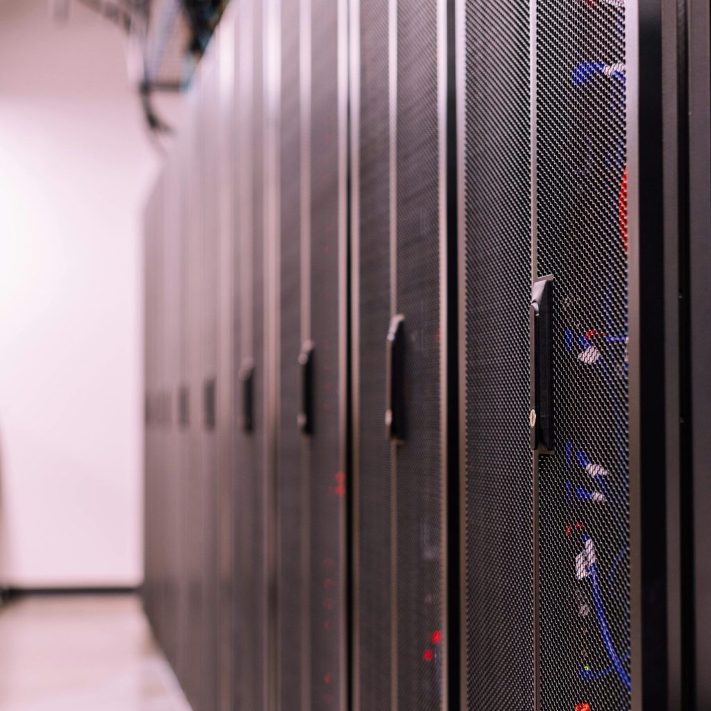 Detailed view of network server racks in a modern data center, highlighting technology infrastructure.